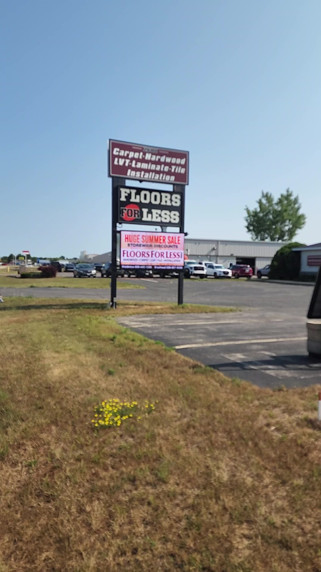 Floors for Less freestanding sign with a digital message display