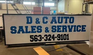 D & C Auto Sales & Service Sign during fabrication in the shop