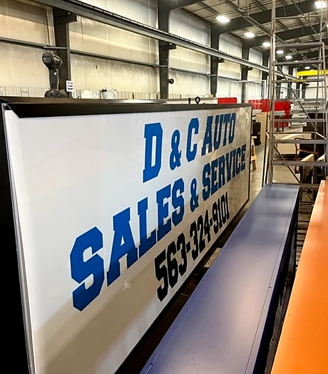 D & C Auto Sales & Service Sign during fabrication in the shop