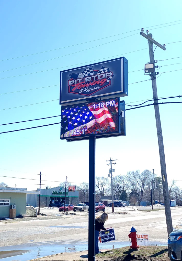 Pit Stop Towing & Repair Digital Sign in its installed setting
