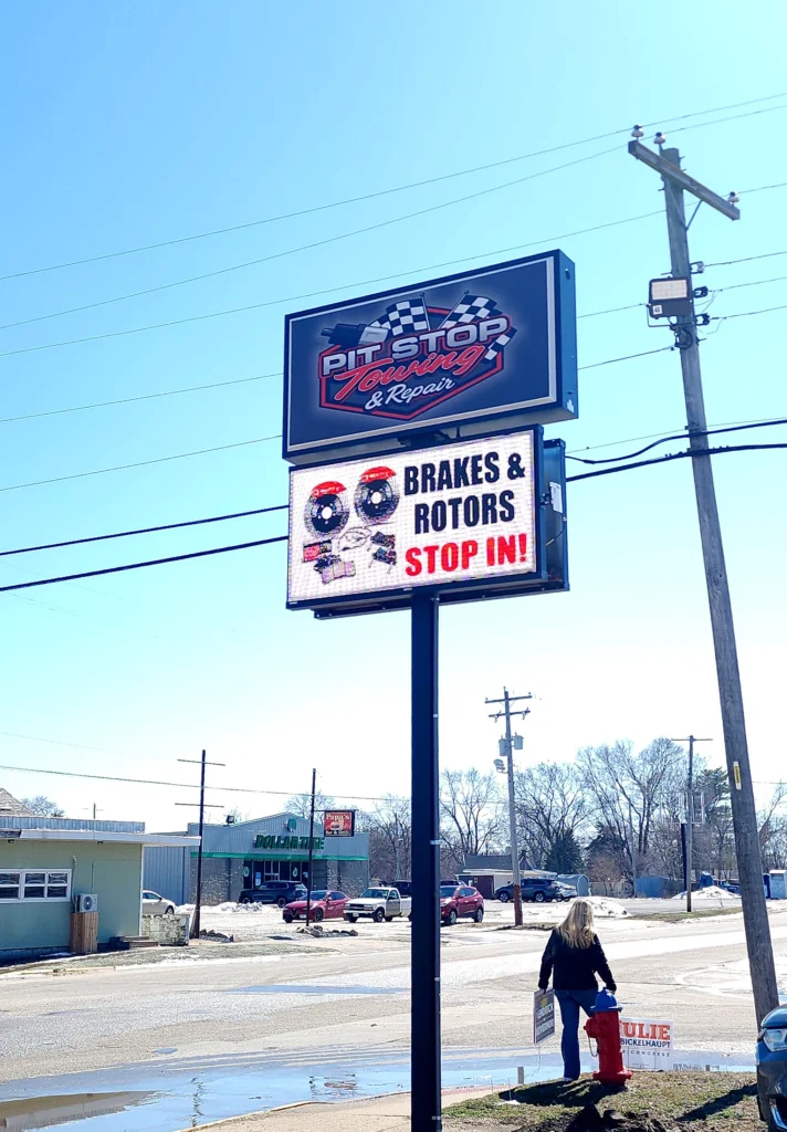 Pit Stop Towing & Repair Digital Sign in its installed setting