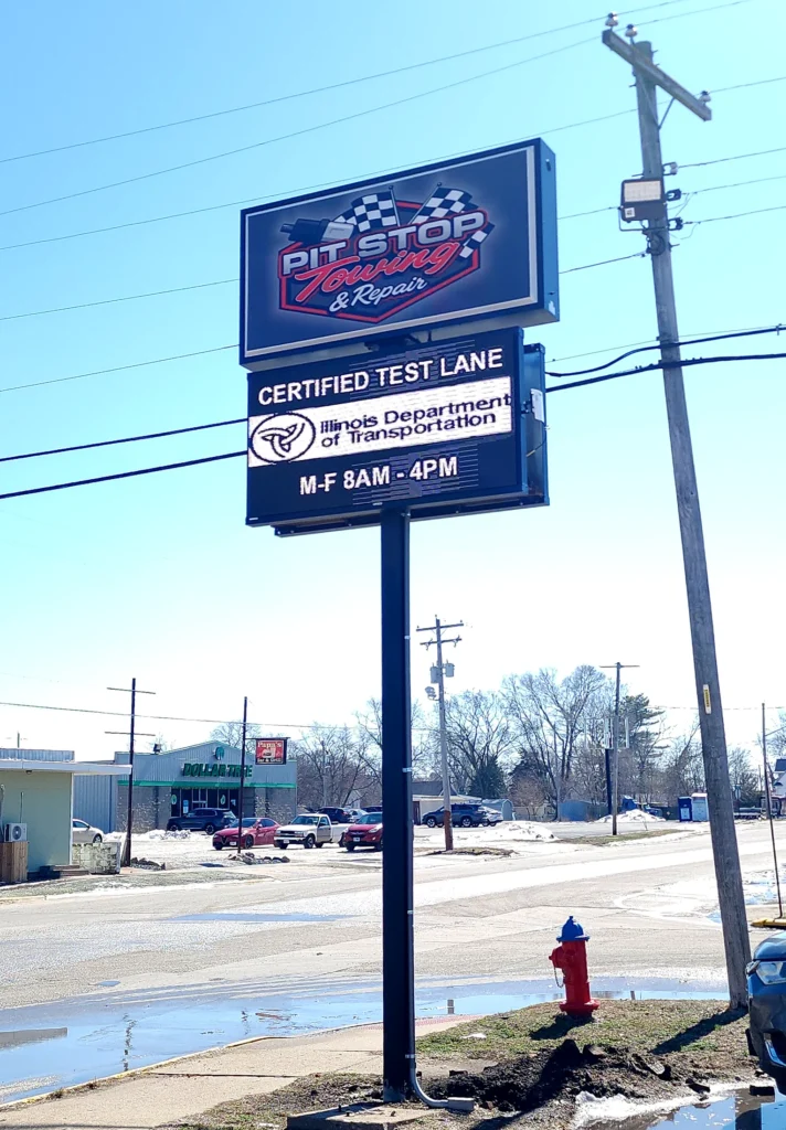 Pit Stop Towing & Repair Digital Sign in its installed setting