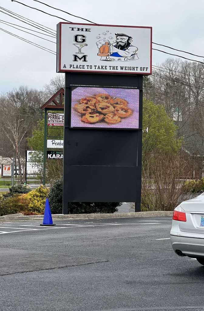 The Gym Bar & Grill Digital Sign in its installed setting
