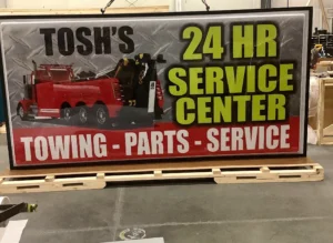 Tosh’s 24 HR Service Center Sign during fabrication in the shop